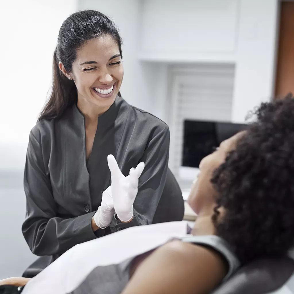 Dentist with patient in dental practice